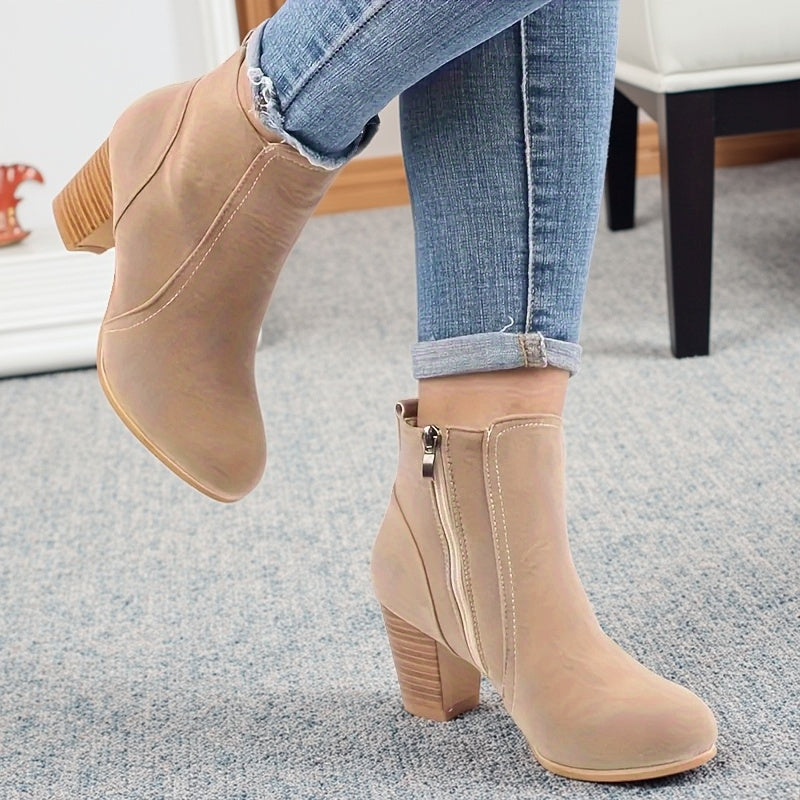 Liv beige heeled ankle boots worn, side zip view