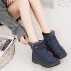 Nell quilted snow boots in navy worn, side view