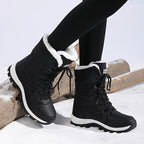 Freya black snow boots, side view showing the chunky grip sole