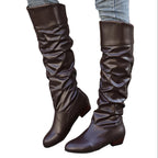 Alva brown ruched flat knee-high boots worn with jeans