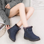 Nell quilted snow boots in navy worn, front view