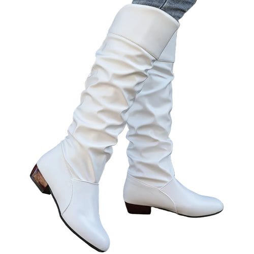 Alva white ruched flat knee-high boots worn with jeans