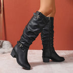 Astrid black knee-high boots showing the side zip