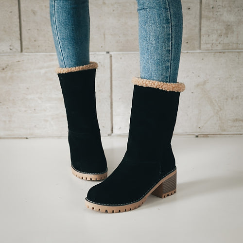 Saga black winter boots worn with the sherpa cuff unrolled