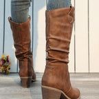 Clemency tan brown cowboy boots worn, back view of the block heels
