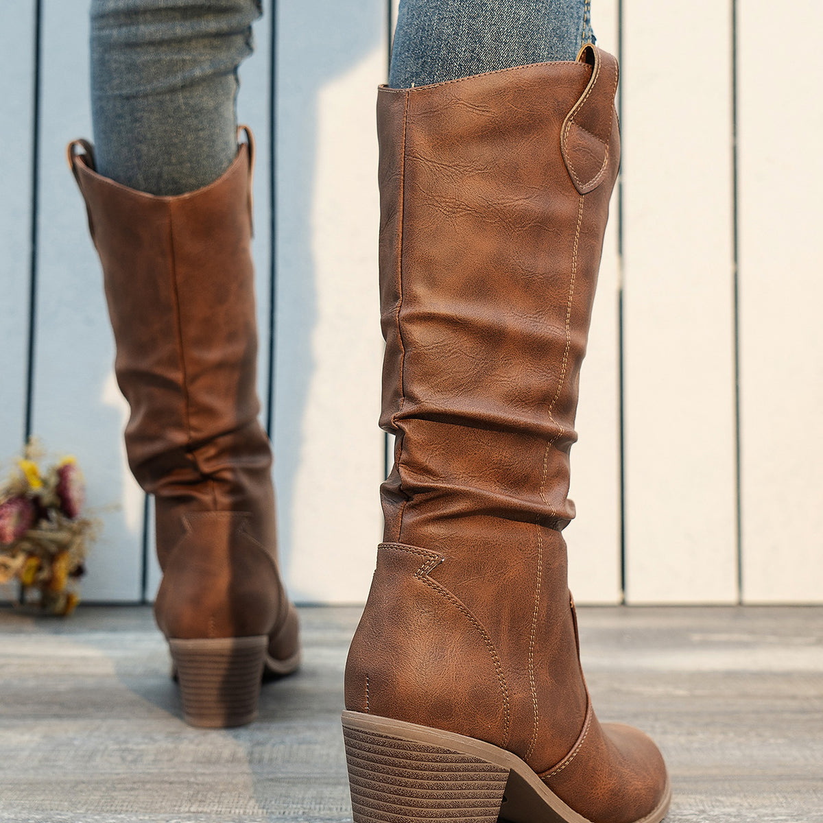 Clemency tan brown cowboy boots worn, back view of the block heels