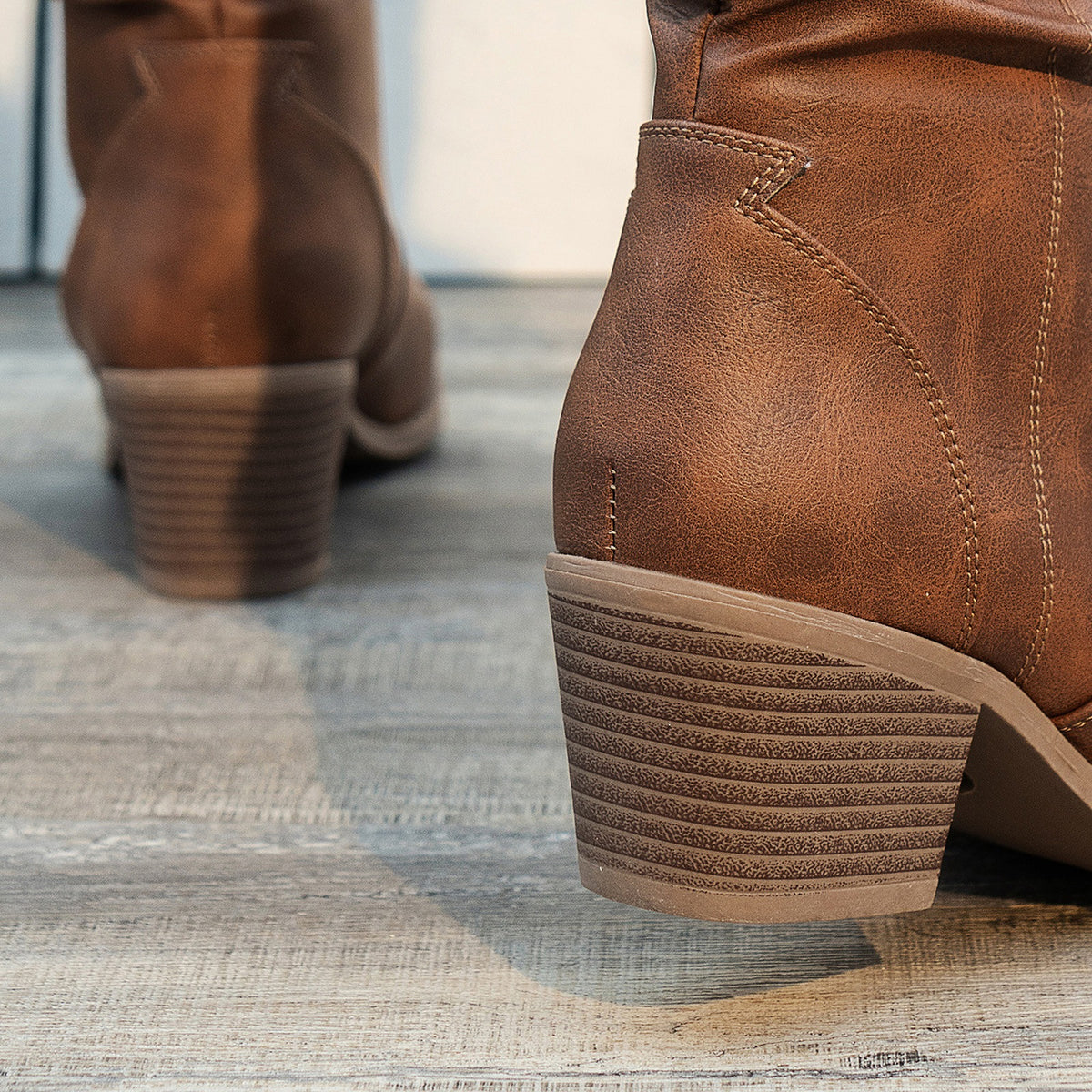 Clemency cowboy boot close-up of the 5.5 cm stacked-effect block heel