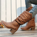 Clemency slouch cowboy boots worn, side view of the round toe and block heel