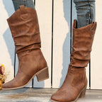 Clemency tan brown slouch Western boots worn with jeans