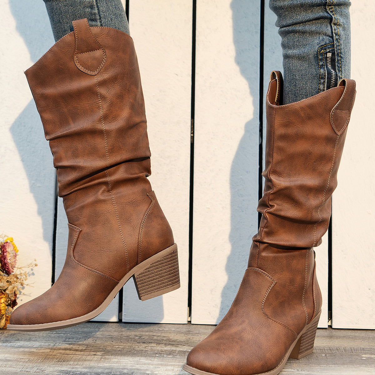 Clemency tan brown slouch Western boots worn with jeans