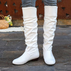 Alva white ruched flat knee-high boots worn, front view