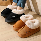 Elin slippers in black and caramel worn
