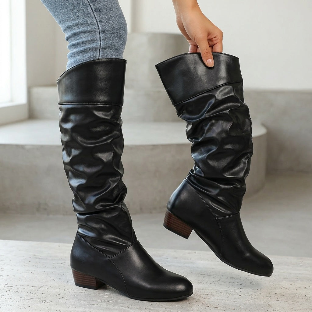 Alva black ruched faux-leather knee-high boots worn
