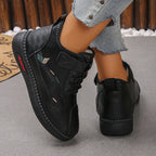 Gunnvor black trainers, back view
