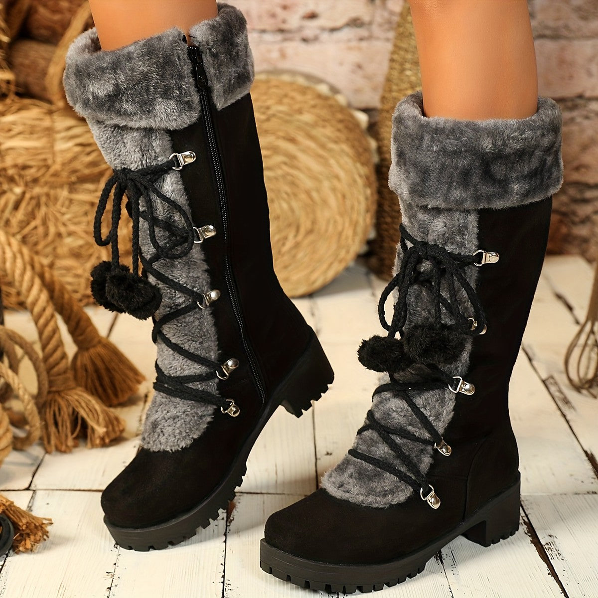 Hjordis winter boots with pom-poms worn