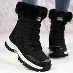 Linnea black fleece-lined snow boots worn in the snow