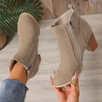 Liv beige suede-effect ankle boot held in hand