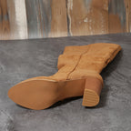 Malin tan knee-high boot sole and stacked heel