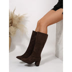 Odile dark brown knee-high boots worn seated