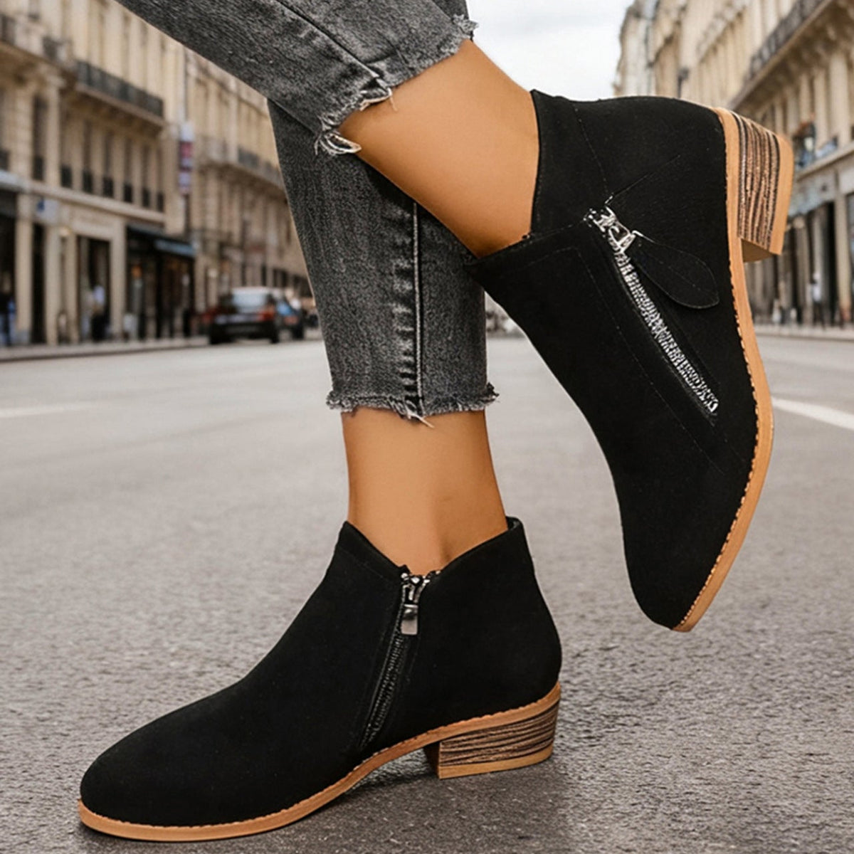 Poppy black pointed-toe block heel ankle boots styled with jeans
