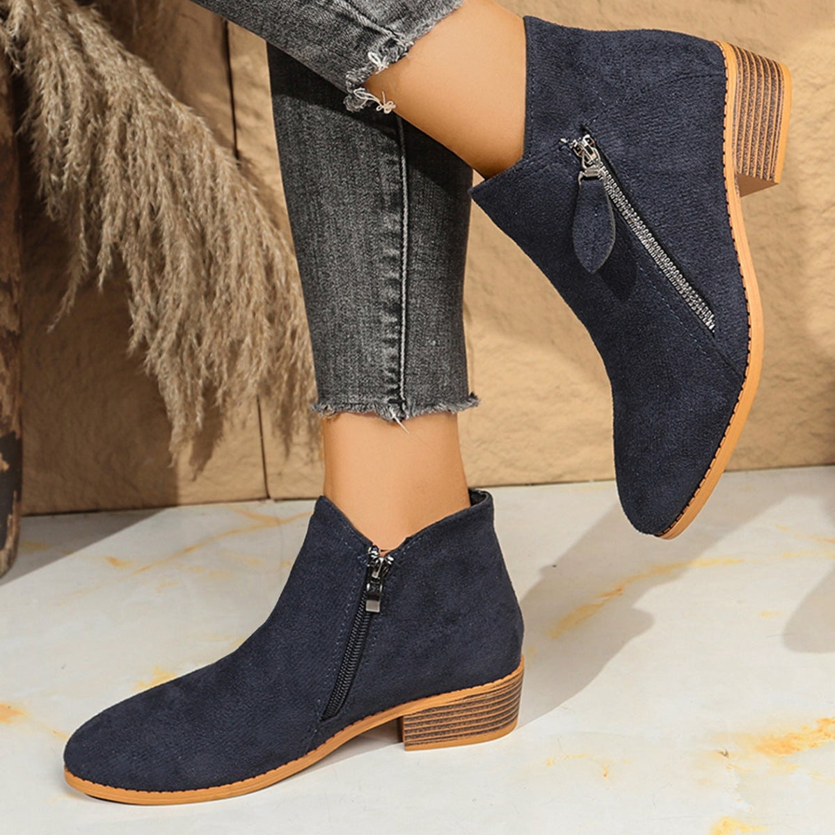 Poppy navy ankle boots worn