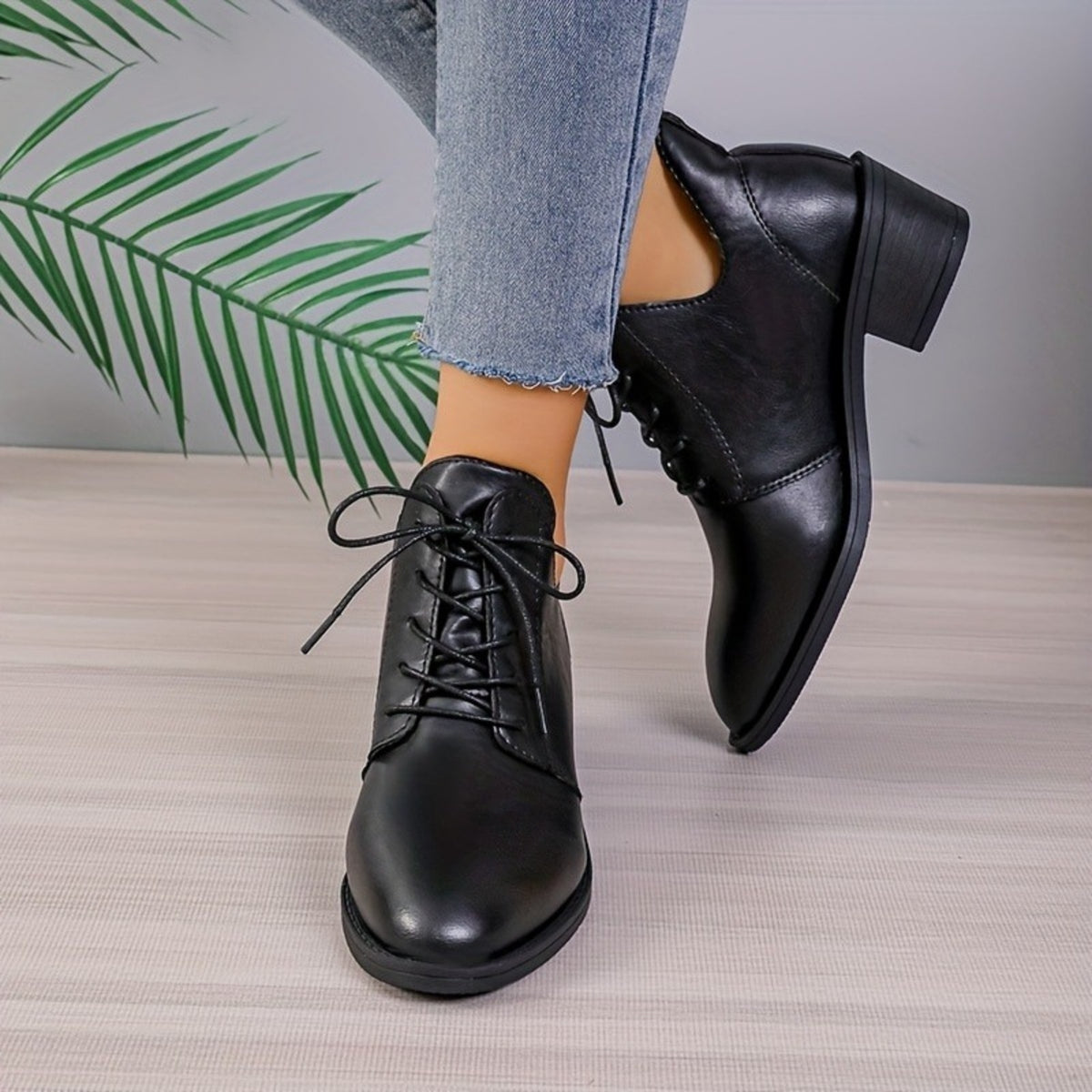 Rosalind black lace-up boots, front view