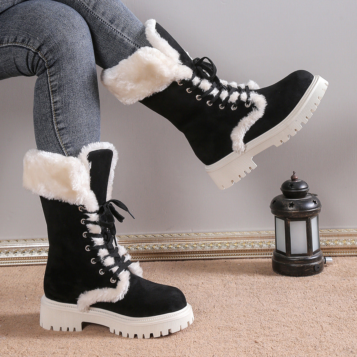 Runa black lace-up snow boots with faux-fur cuff, side view