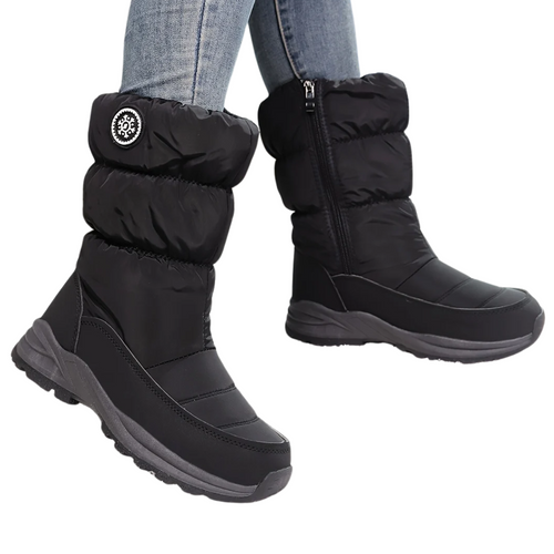Sigrid black puffer mid-calf snow boots worn in the snow