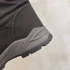 Sigrid black snow boots heel close-up