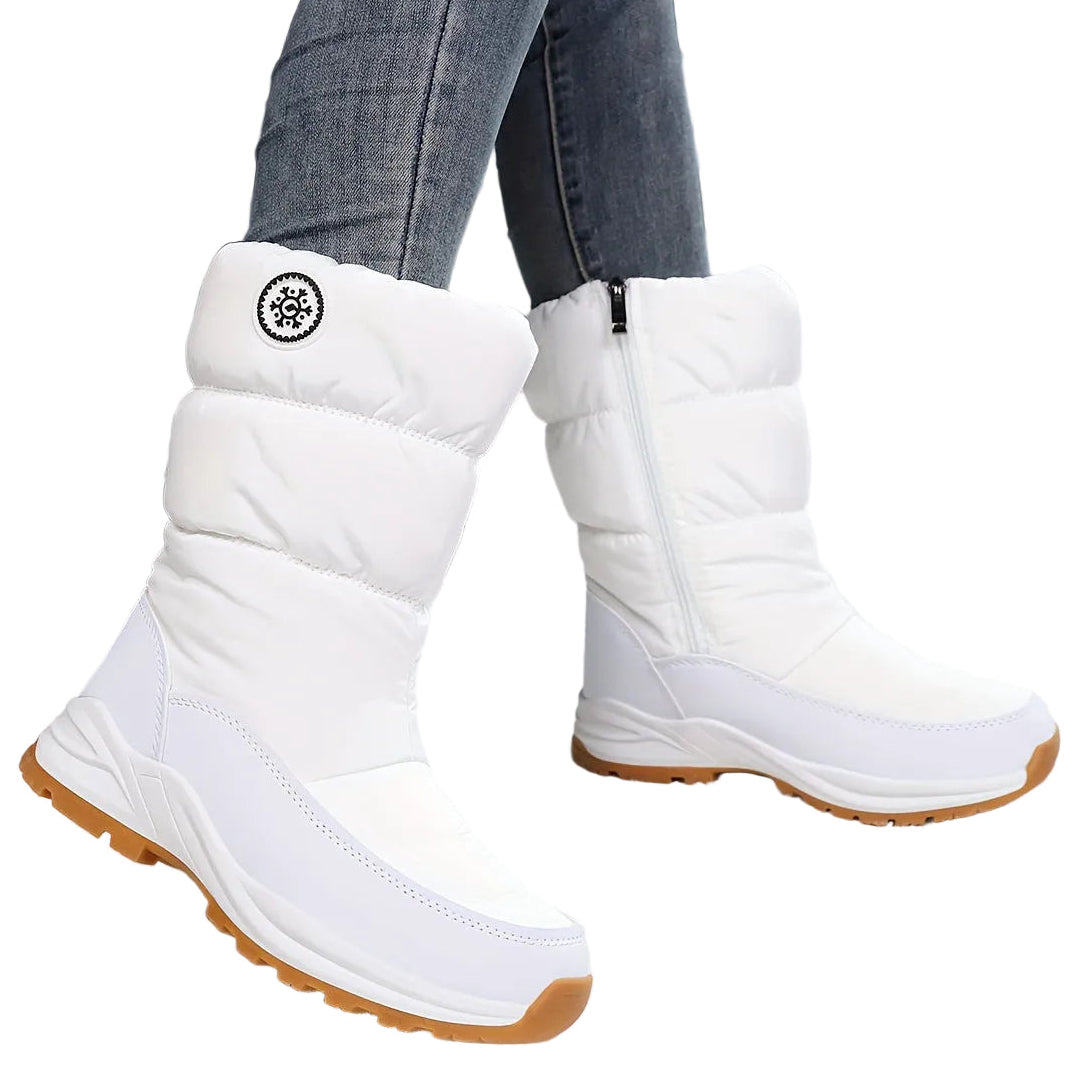 Sigrid white puffer mid-calf snow boots worn in the snow