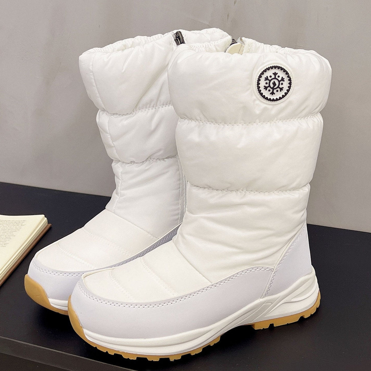 Sigrid white puffer snow boots with snowflake badge, pair