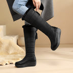 Solveig black faux-fur lined boots worn, side view