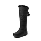 Solveig black puffer snow boot, side view with back tie