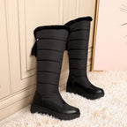 Solveig black snow boots, pair standing