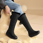 Solveig black snow boots worn with jeans