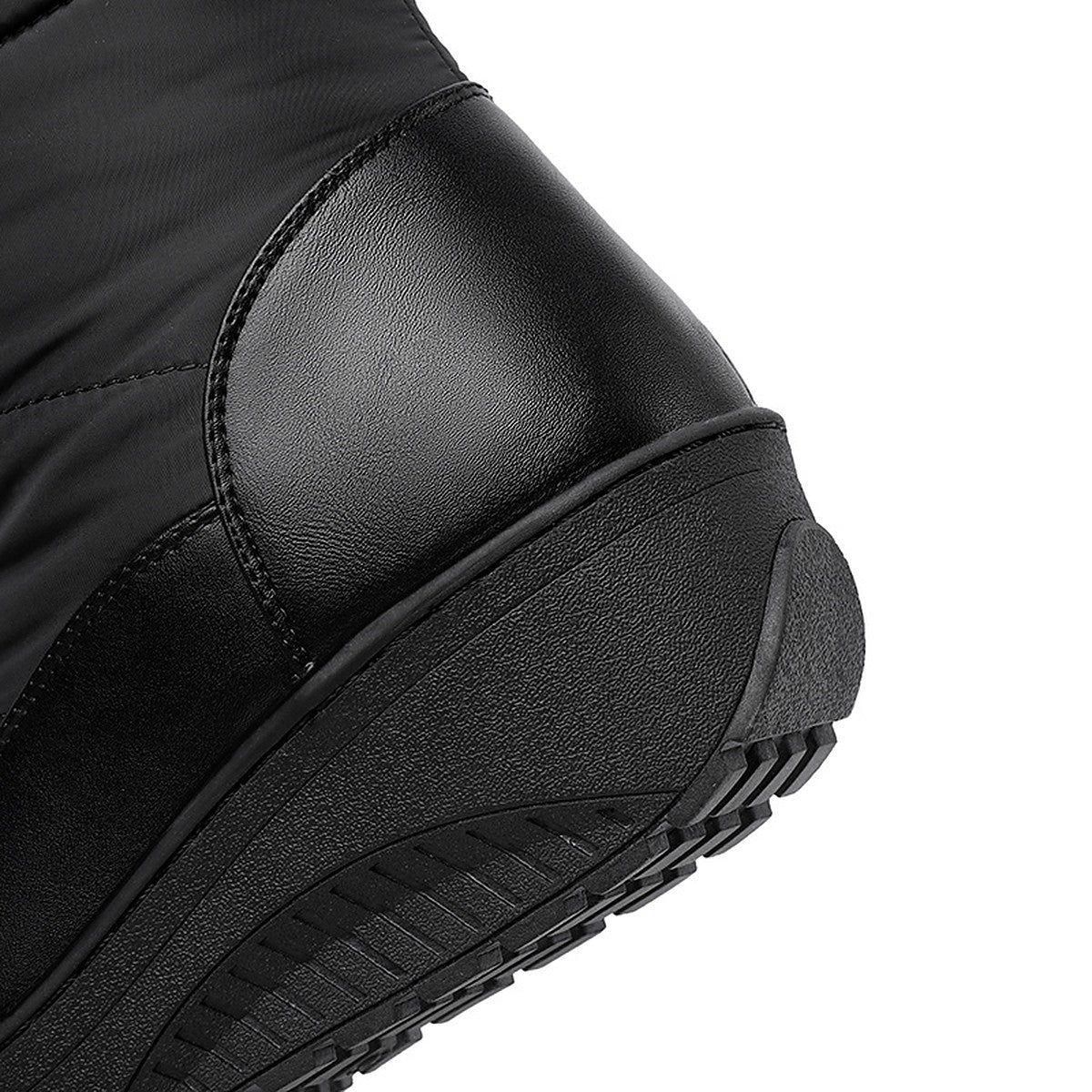 Solveig snow boots heel panel and wedge sole close-up