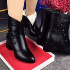 Thessaly black ankle boots showing the white fleece lining