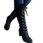 Tove black faux-suede lace-up knee-high boots worn with jeans