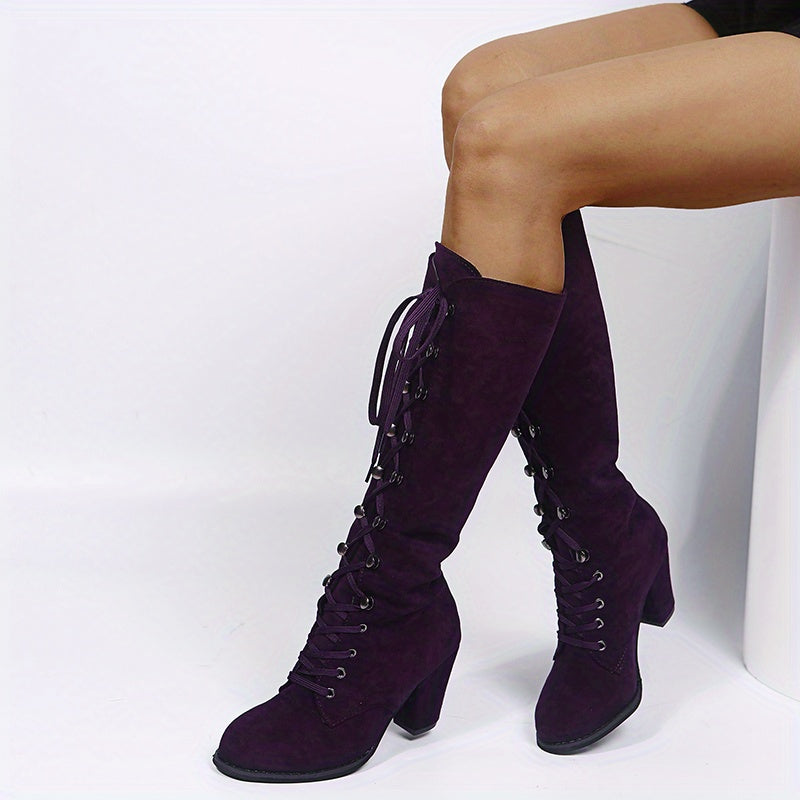 Tove purple faux-suede lace-up knee-high boots worn, sitting