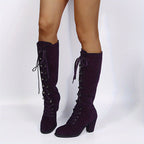 Tove purple lace-up knee-high boots, standing front view