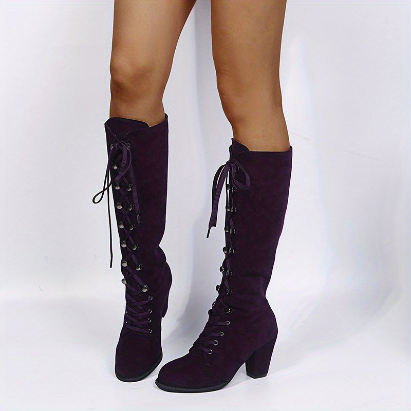 Tove purple lace-up knee-high boots, standing front view