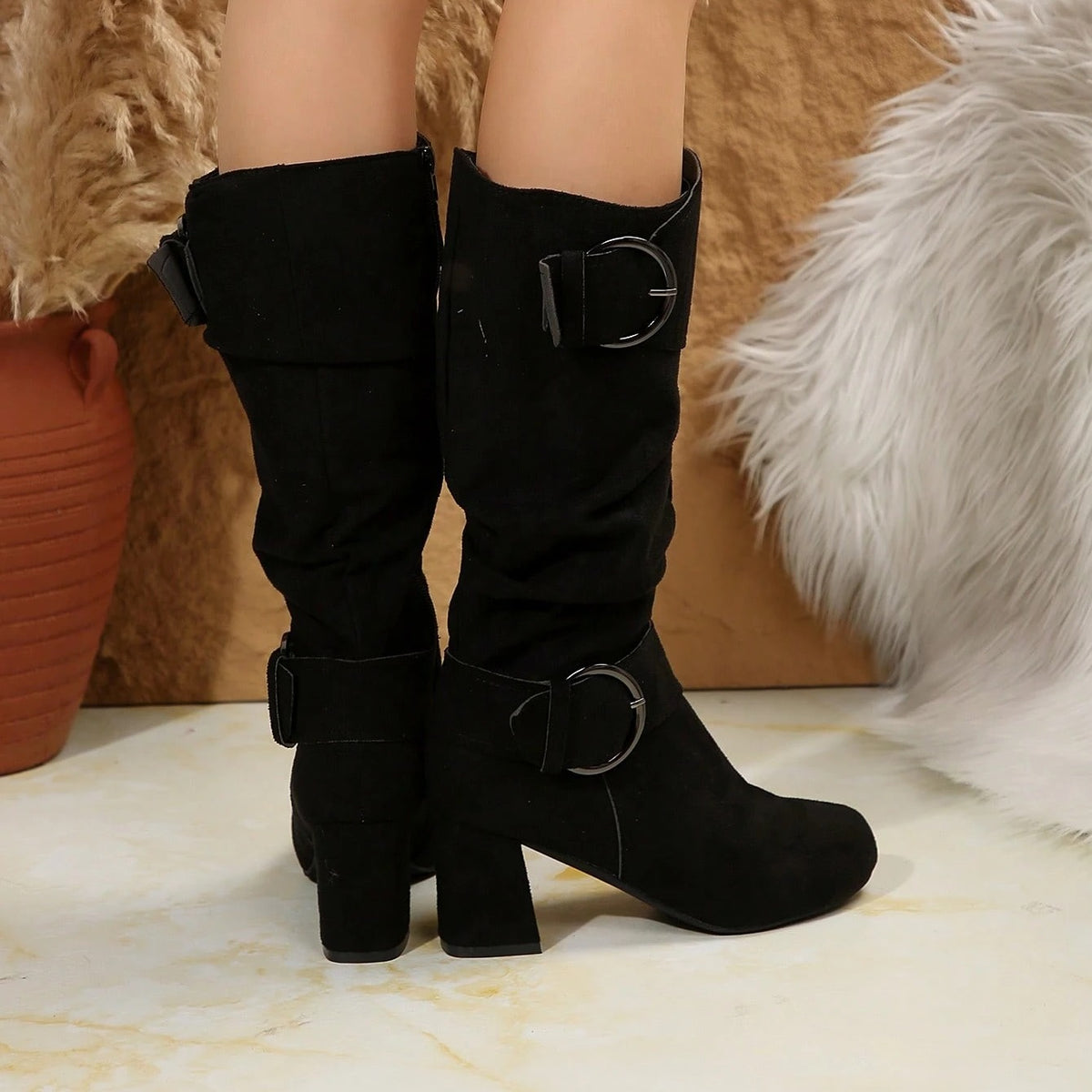 Tyra black slouch mid-calf boots worn, back view with block heel