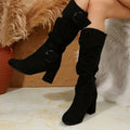 Tyra black slouch mid-calf boots worn, side view
