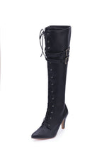 Vigdis black knee-high boot with buckle straps, side view