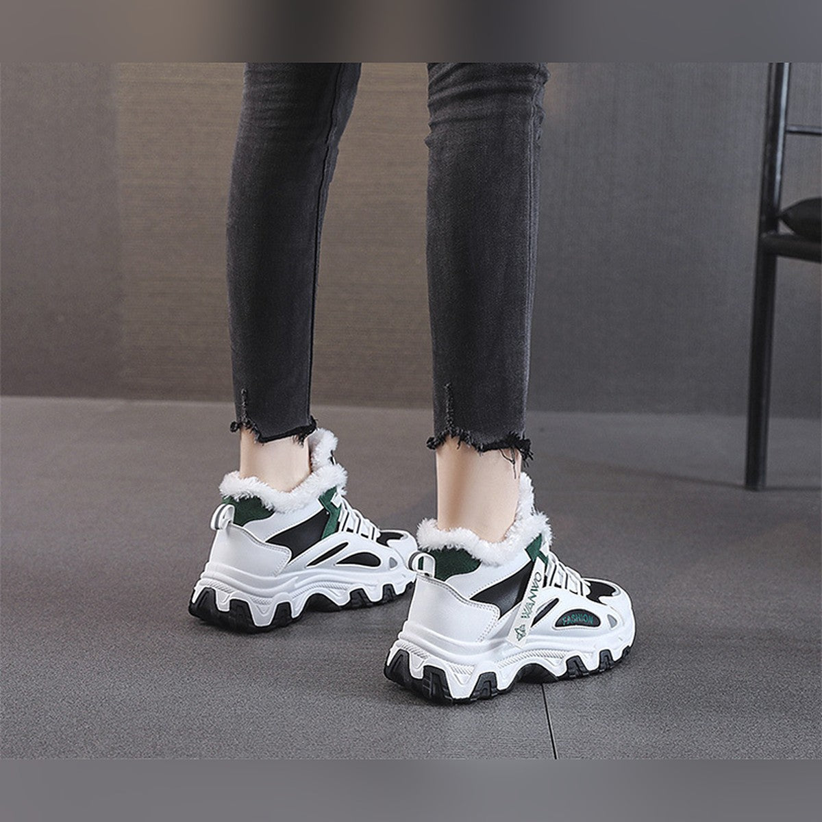 Ylva black and green trainers worn, back view