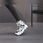 Ylva black and green trainers worn, side view