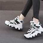 Ylva black and green winter trainers worn with jeans