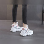 Ylva grey and pink trainers worn, back view
